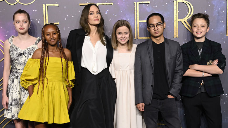 Shiloh Jolie-Pitt, Zahara Jolie-Pitt, Angelina Jolie, Vivienne Jolie-Pitt, Maddox Jolie-Pitt and Knox Jolie-Pitt posing on the red carpet