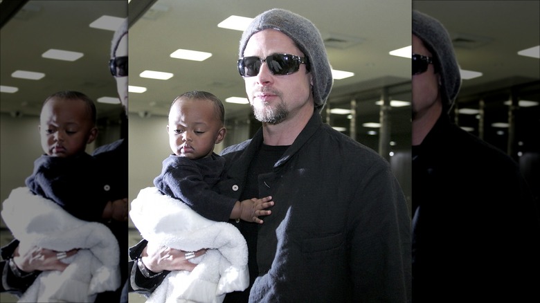 Brad Pitt holding Zahara Marley Jolie in 2005