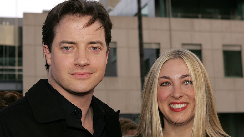 Brendan Fraser and Afton Smith posing