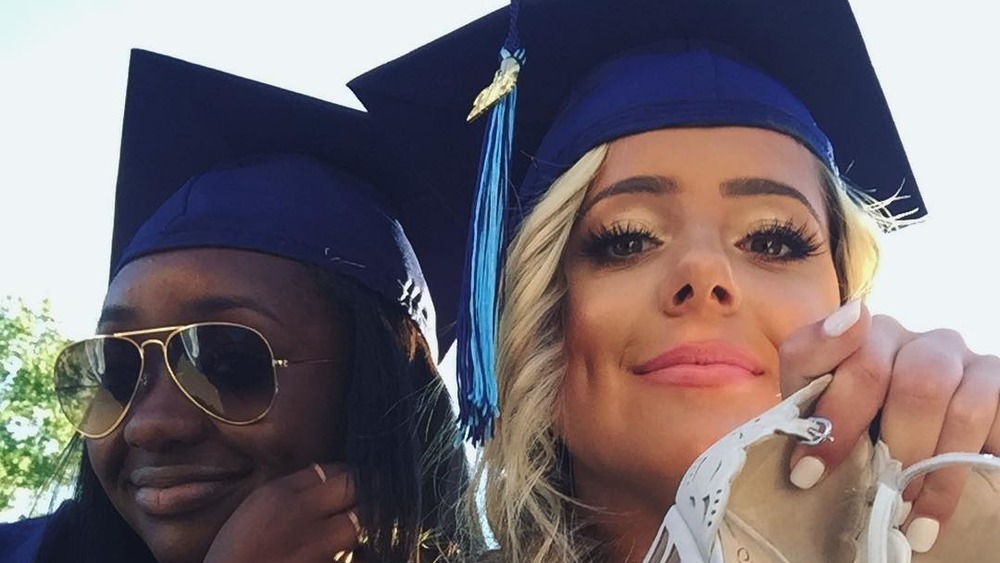 A friend and Brielle Biermann at high school graduation