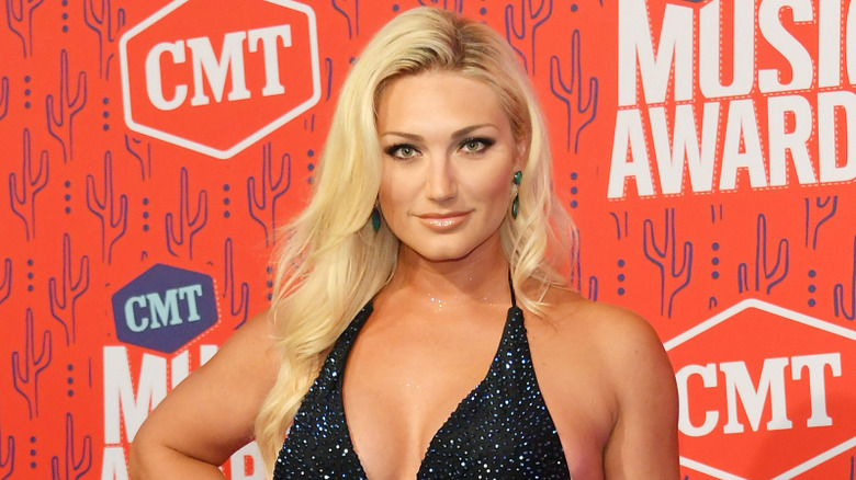 Brooke Hogan wearing a black dress