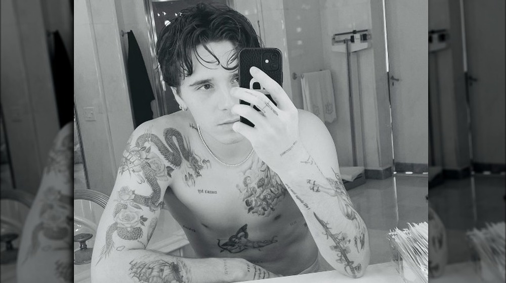 Brooklyn Beckham shows off his tattoos in a selfie