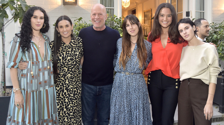 Bruce Willis posing with family