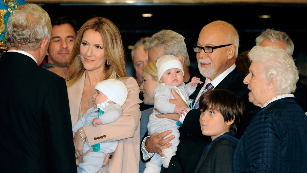 Céline Dion smiling with family