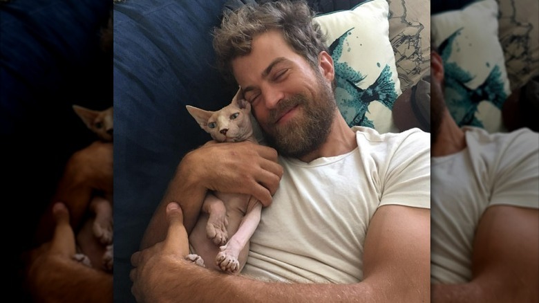 Sterling Taylor cuddling cat