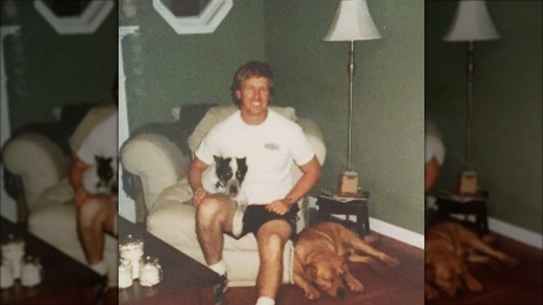 Chip Gaines seated in living room with dogs