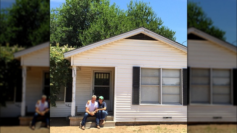 Chip Gaines, Joanna Gaines sitting on front steps of one of the first homes they bought