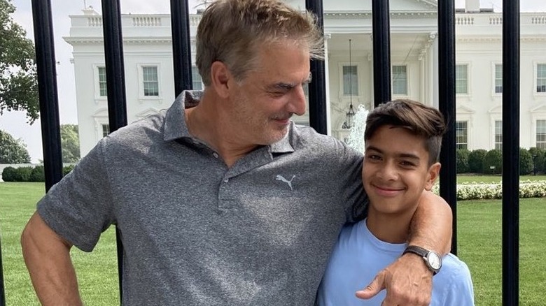 Chris Noth posing with son Orion in front of The White House