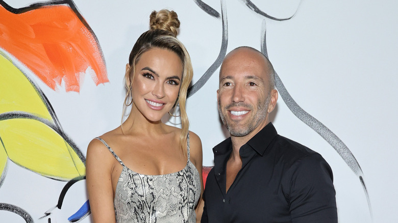 Chrishell Stause and Jason Oppenheim pose