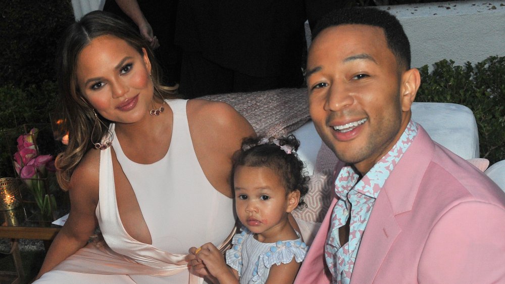 Chrissy Teigen and John Legend with their daughter