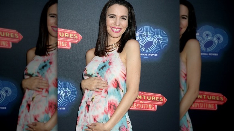 Christy Carlson Romano cradling stomach