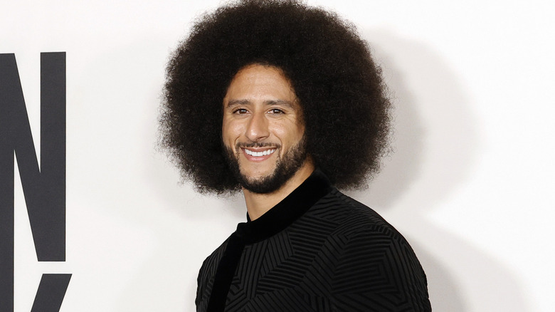 Colin Kaepernick smiling in 2021