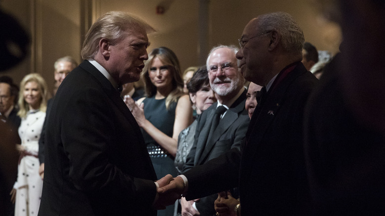 U.S. President Donald Trump shaking hands with Colin Powell, former U.S. secretary of state, during the Ford's Theatre Gala