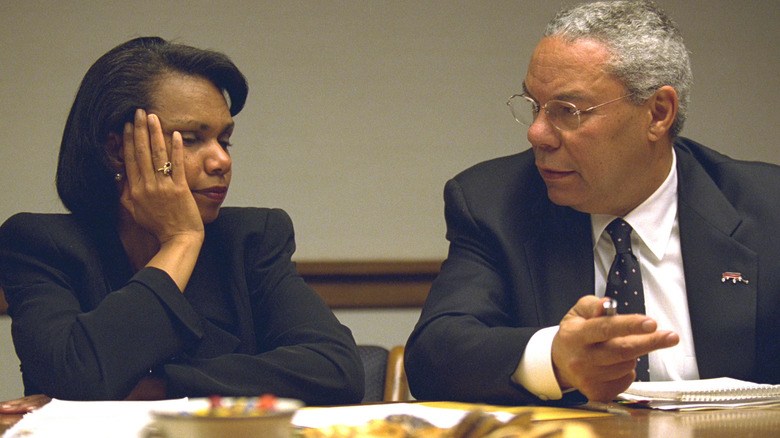 Condoleezza Rice and Colin Powell chatting