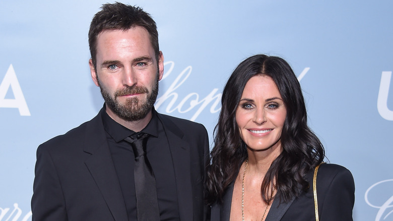 Johnny McDaid and Courteney Cox at an event