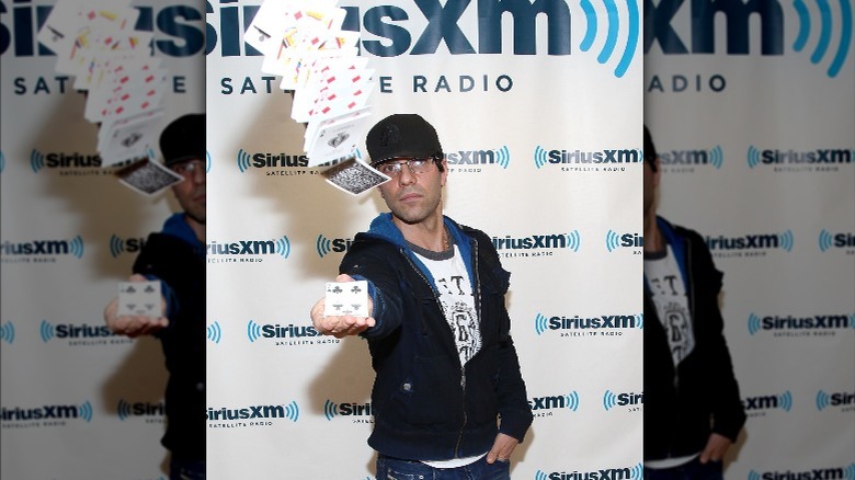 Criss Angel throwing playing cards