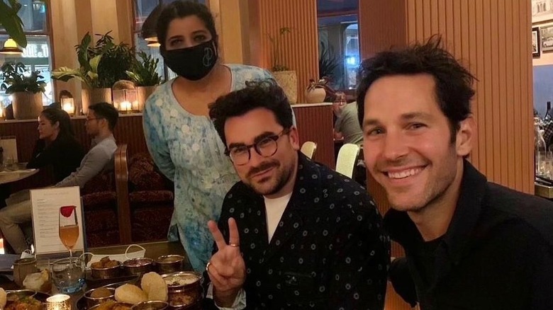 Dan Levy and Paul Rudd eating