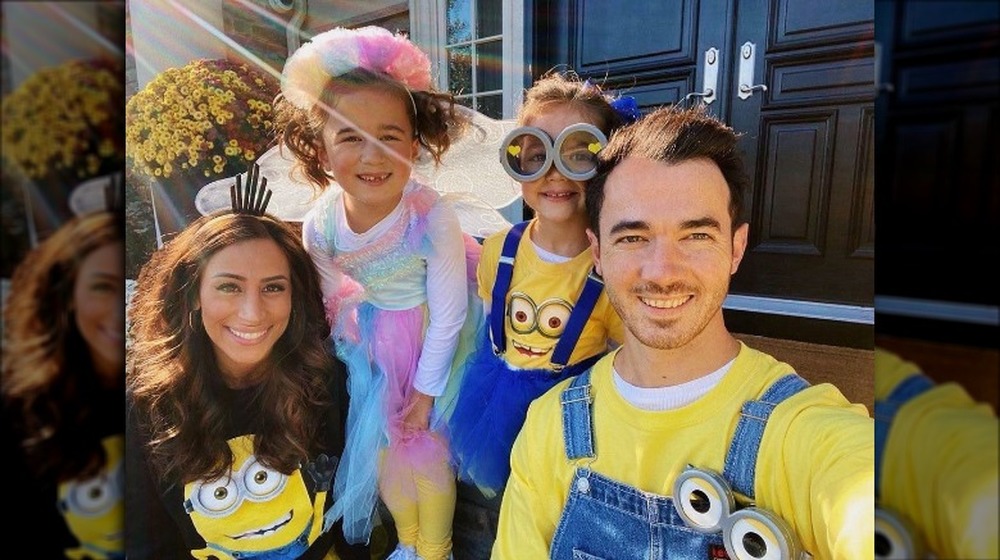 Danielle Jonas and Kevin Jonas with kids on Halloween