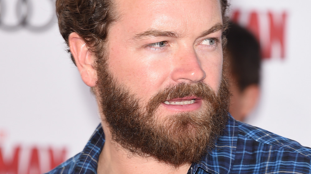 Danny Masterson looking to his side