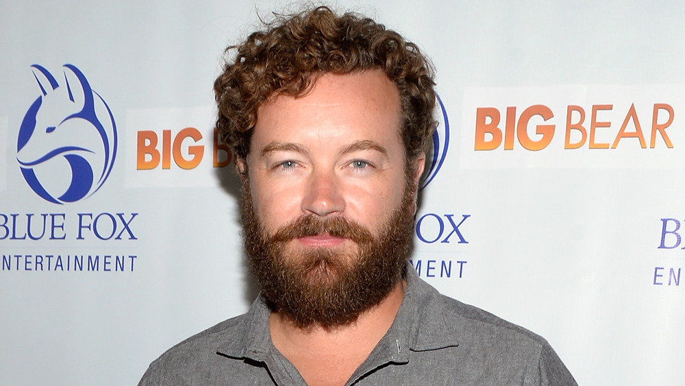 Danny Masterson with a slight smile 