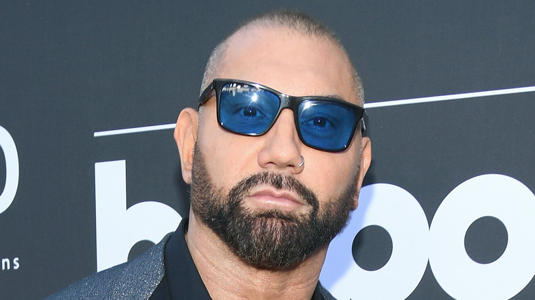 Dave Bautista in sunglasses looking at camera