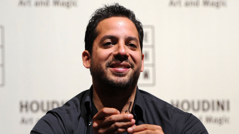 David Blaine smiling during a trick