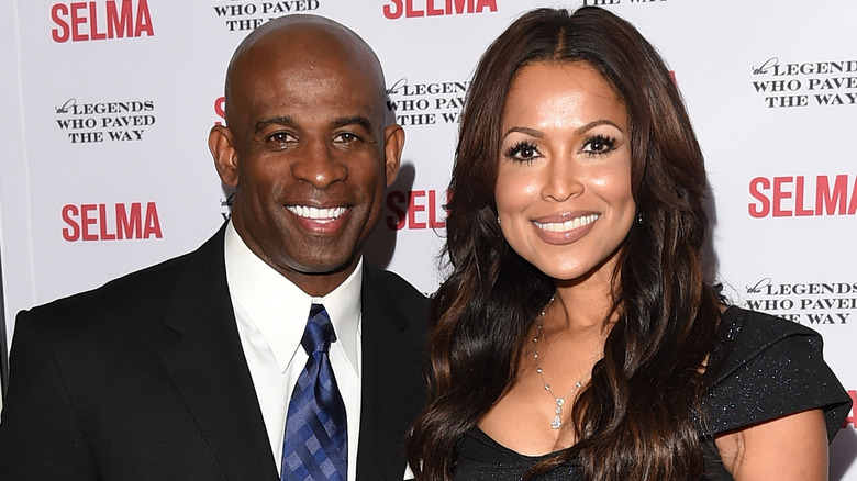 Deion Sanders and Tracey Edmonds posing