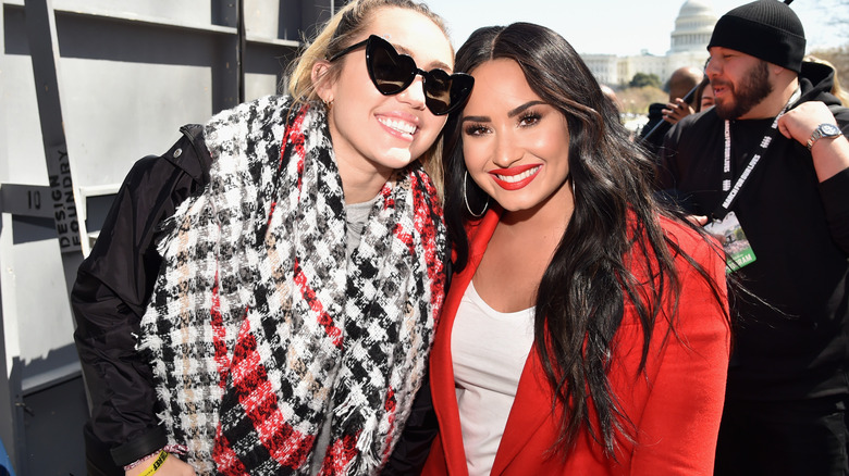 Miley Cyrus and Demi Lovato smiling