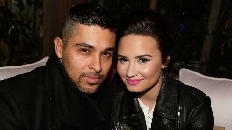 Wilmer Valderrama and Demi Lovato posing