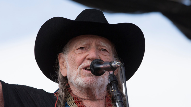 willie nelson performs on stage