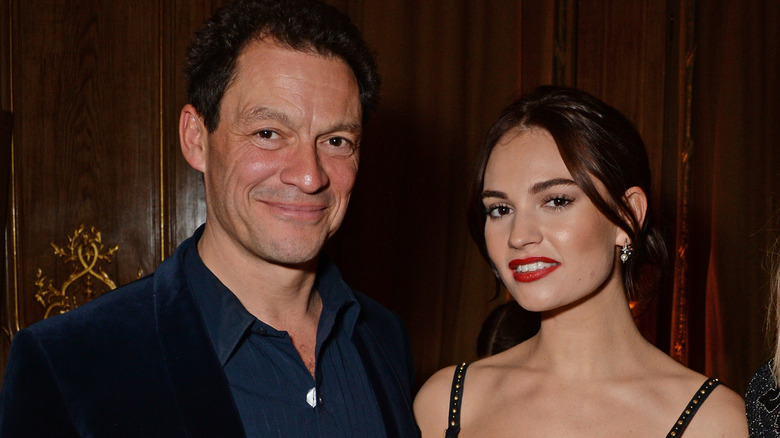 Dominic West and Lily James smiling