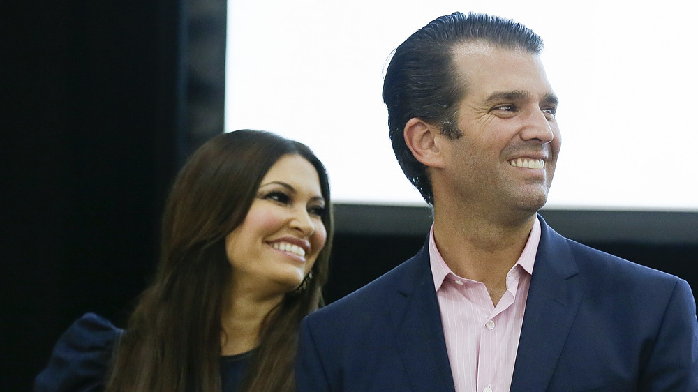 Kimberly Guilfoyle, Donald Trump Jr. smiling