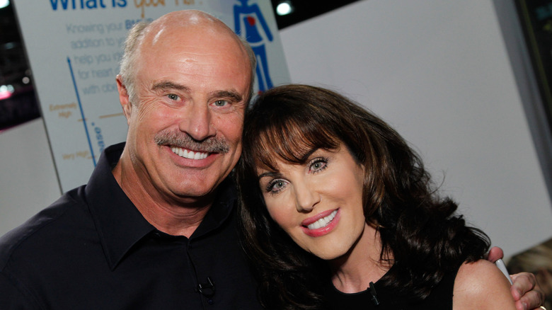 Dr. Phil McGraw posing with wife Robin