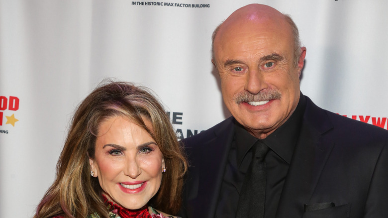 Robin McGraw and Dr. Phil McGraw on red carpet