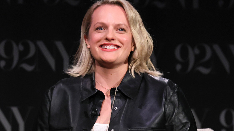 Elisabeth Moss smiling while seated