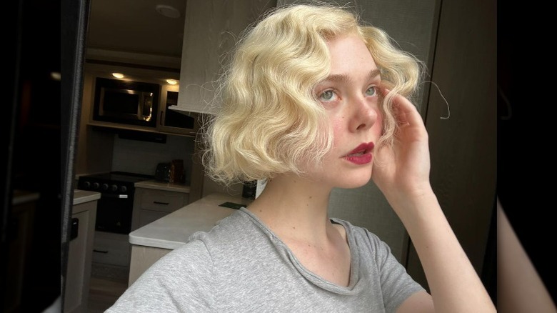 Elle Fanning wearing blonde bobbed wig