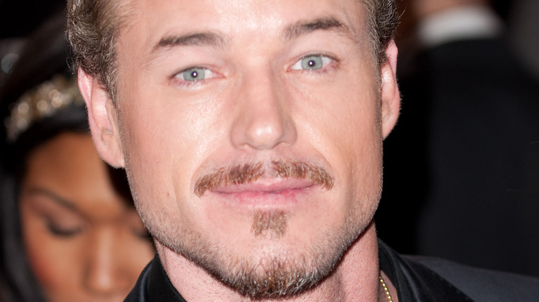 Eric Dane poses in a dark suit 