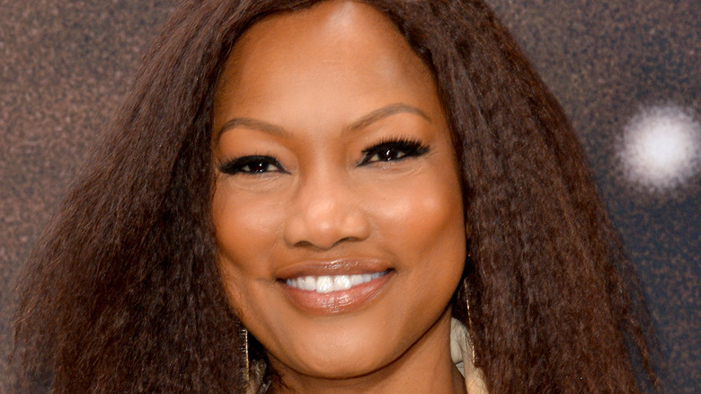 Garcelle Beauvais smiles at an event