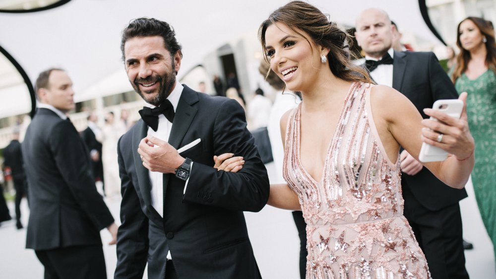 Jose Baston and Eva Longoria walking at a formal event together