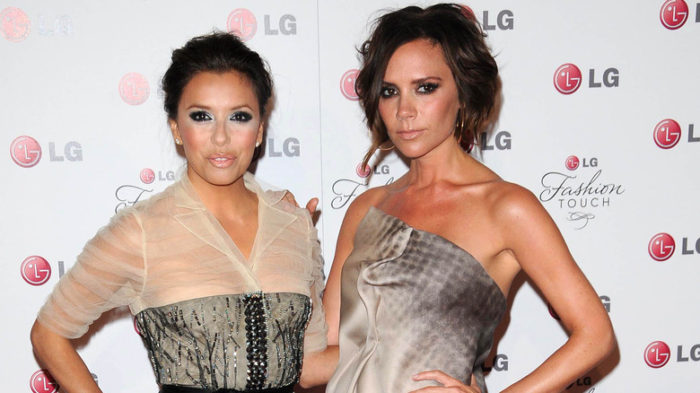 Eva Longoria and Victoria Beckham posing together