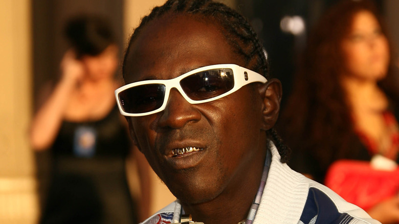 Flavor Flav with a serious expression