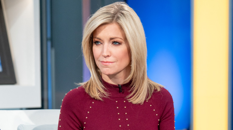 Ainsley Earhardt wearing maroon sweater on "Fox & Friends" set