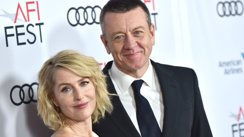 Gillian Anderson and Peter Morgan at an event 