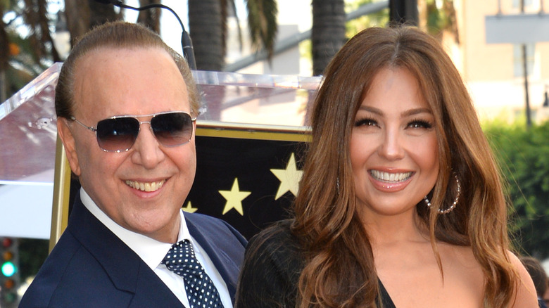 Tommy Mottola and Thalia, both smiling