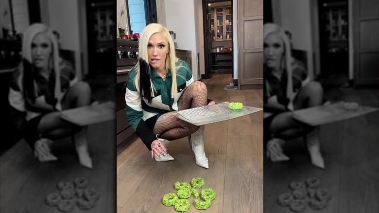 Gwen Stefani in her kitchen with spilled plate of rice krispy treat wreaths