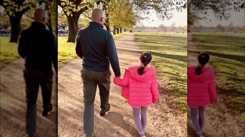 Gianluca Cugnetto walking with his daughter 