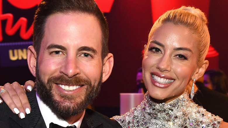 Tarek El Moussa and Heather Rae Young sitting at the MTV awards