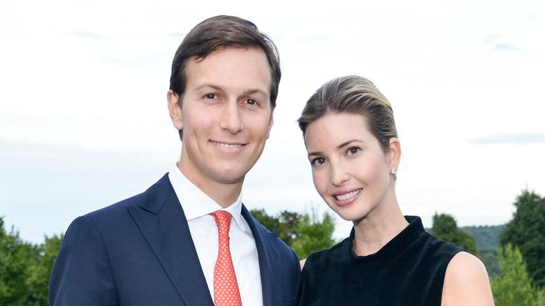 Ivanka Trump and Jared Kushner smiling at an event 