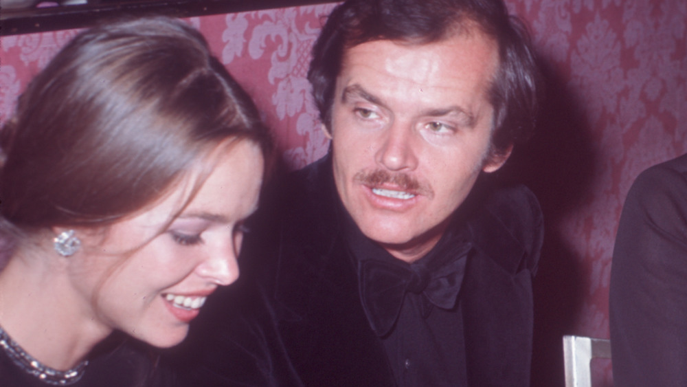 Singer Michelle Phillips and actor Jack Nicholson seated together