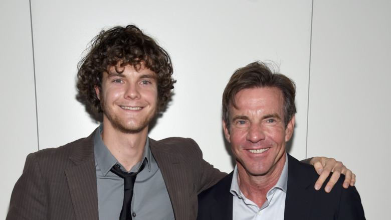 Jack Quaid and Dennis Quaid smile 